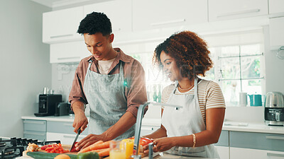 Buy stock photo Cooking, vegetables and couple in kitchen in home for nutrition, wellness or healthy dinner together. Ingredients, bonding and man with woman for preparing diet meal for supper with vitamins in house