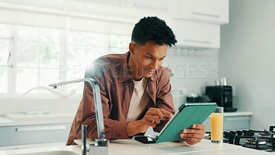 Buy stock photo Man, smile and tablet in kitchen, home and search for recipe, video and learning with subscription. Person, digital touchscreen and application for online course, happy and cooking lessons at house