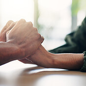 Care, comfort and couple holding hands on table for love, loyalty and ...