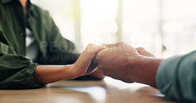 Buy stock photo Care, comfort and couple holding hands for love, loyalty and connection in home on table. Support, kindness and people closeup for empathy, forgive partner and commitment for relationship together