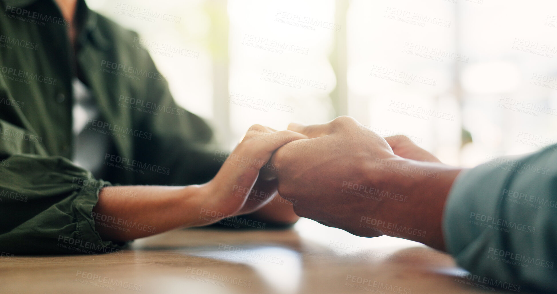 Buy stock photo Care, comfort and couple holding hands for love, loyalty and connection in home on table. Support, kindness and people closeup for empathy, forgive partner and commitment for relationship together