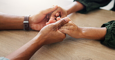 Buy stock photo Trust, support and couple holding hands on table for love, loyalty and connection in home. Comfort, kindness and people closeup for empathy, forgive partner and commitment for relationship together