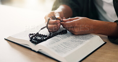 Buy stock photo Bible, hands and person reading book with rosary in spiritual religion for peace, guidance and learning. Beads, house or worship with praise, scripture and gratitude with prayer, faith and gospel