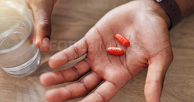 Buy stock photo Above, medicine or hands with pills, vitamin supplements and medical prescription in home. Glass, wellness and healthcare tablets for virus, sick person with medication, water or pharmaceutical drugs