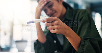 Buy stock photo Home, sad and woman with pregnancy test, stress and overwhelmed with negative fertility result. Apartment, maternity or person in lounge, disappointed and fail with IVF, upset or worried with anxiety