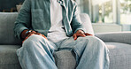 Hands, nervous and psychology with person on sofa in ptsd or trauma counseling session closeup. Anxiety, stress and therapy with patient at consulting appointment in clinic for grief, loss or pain
