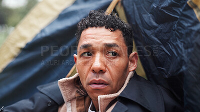 Buy stock photo Homeless, poverty and thinking with man in park for depression, unemployment rate and winter crisis. Mental health risk, refugee and welfare aid with male person in tent for tired, poor and worry