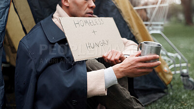 Buy stock photo Hands, homeless and poverty with cardboard, sign or cup for begging money, change and tent at park. Person, outdoor and poster for donation, help and hungry on ground with hope for support in Brazil