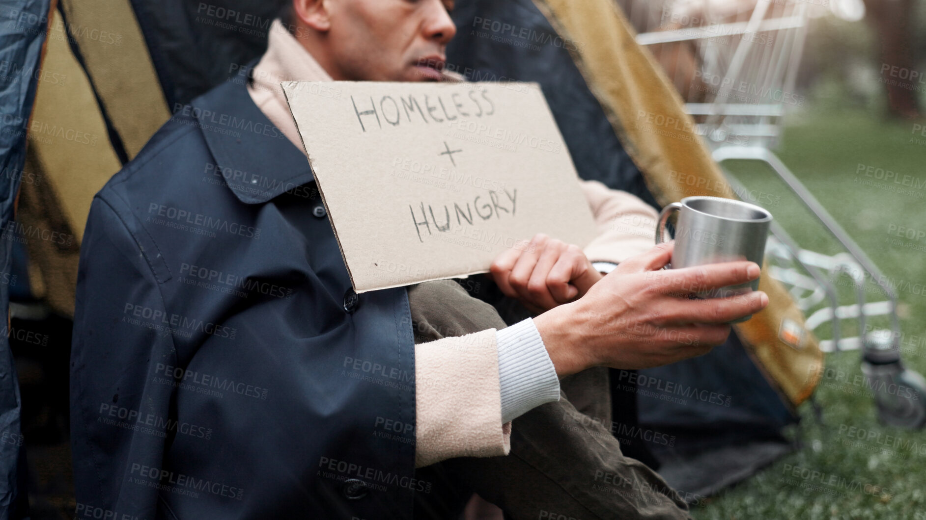 Buy stock photo Hands, homeless and poverty with cardboard, sign or cup for begging money, change and tent at park. Person, outdoor and poster for donation, help and hungry on ground with hope for support in Brazil