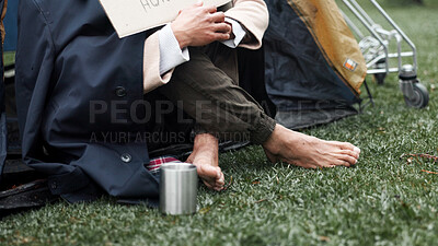 Buy stock photo Homeless, poverty and cold with feet of person in park for depression, unemployment rate and crisis. Mental health, refugee and welfare aid with closeup of beggar and tent for tired, poor and worry