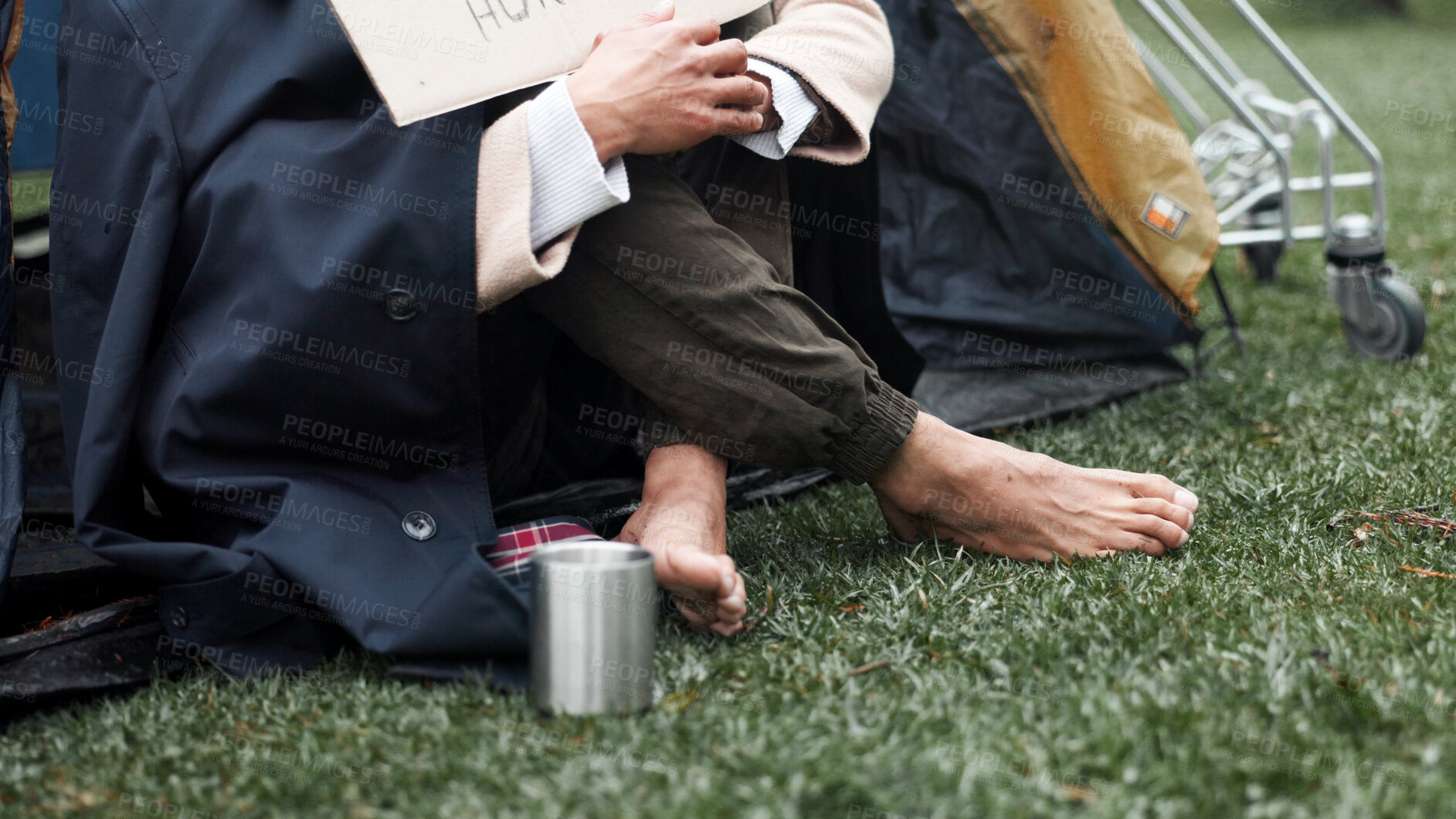 Buy stock photo Homeless, poverty and cold with feet of person in park for depression, unemployment rate and crisis. Mental health, refugee and welfare aid with closeup of beggar and tent for tired, poor and worry