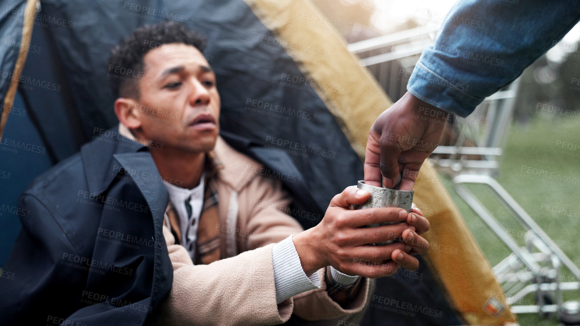 Buy stock photo Homeless, hands and person help with money for poverty donation, financial aid or compassion. Tent, beggar and giving coins for empathy, generosity and charity with vulnerability or desperate outdoor