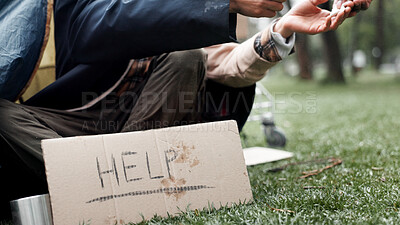 Buy stock photo Hands, homeless and poverty with sign, drugs or deal for begging money, change or tent at park. Person, addiction and cardboard poster with bag, powder or narcotic substance abuse for habit on ground