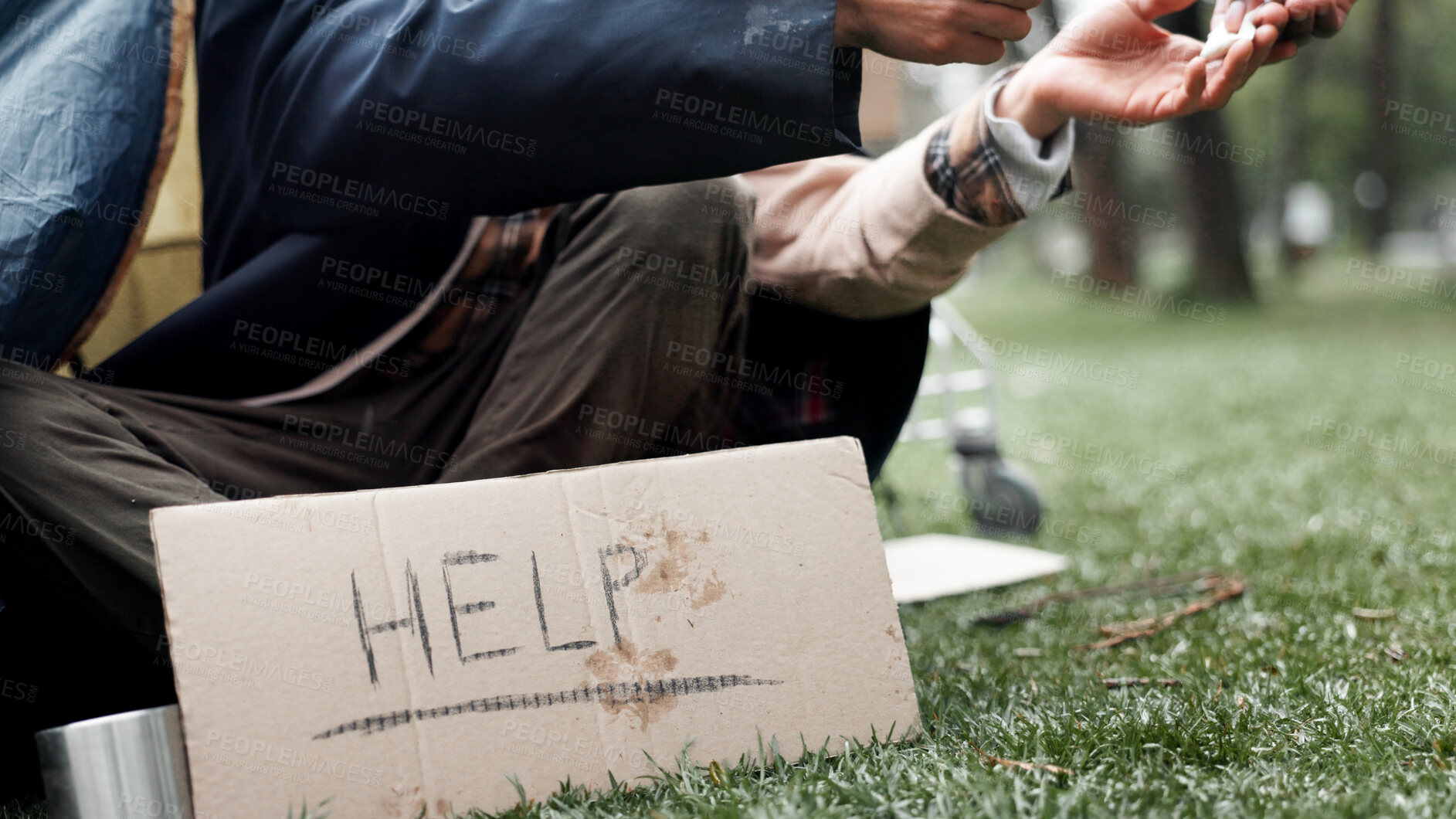 Buy stock photo Hands, homeless and poverty with sign, drugs or deal for begging money, change or tent at park. Person, addiction and cardboard poster with bag, powder or narcotic substance abuse for habit on ground