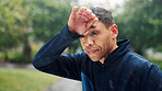 Fatigue, fitness and running with man in park for cardio exercise, marathon training or workout. Exhausted, sports and sweat with tired athlete or runner outdoor for break, health and wellness