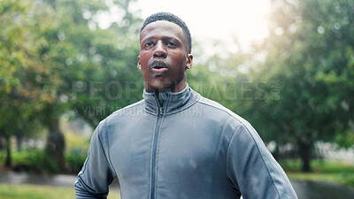 Buy stock photo Fitness, man and tired with breathing outdoor for cardio burnout, workout recovery and endurance challenge. Athlete, black person and resting in rain with training break, marathon exercise or fatigue