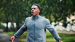 Athlete, fitness and man with stretching outdoor for running performance, muscle strength or getting ready. Rain, black person and arm warm up at park for cardio workout, breathing or sports training