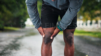 Buy stock photo Hands, outdoor and man with knee pain, fitness and exercise with fibromyalgia. Closeup, person and runner in street, arthritis and orthopedic problem with sports injury, muscle tension and training