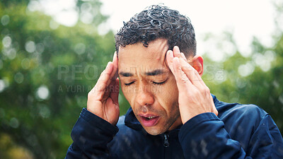 Buy stock photo Fatigue, fitness and headache with man outdoor in park for cardio training, marathon or running. Burnout, exercise and pain with tired athlete or runner in nature for challenge, health or workout