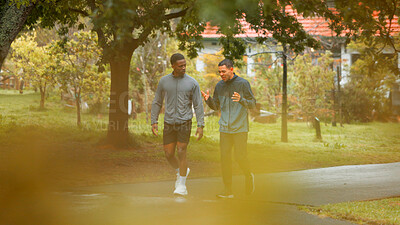 Buy stock photo Nature, fitness and men walking in park planning route for cardio workout with marathon training. Sports, conversation and male athletes outdoor in garden for exercise together with activity.