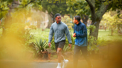 Buy stock photo Nature, sports and men walking in park planning route for cardio workout with marathon training. Fitness, conversation and male athletes outdoor in garden for exercise together with activity.