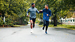 Fitness, running and people with fist bump outdoor for marathon training, challenge success and race celebration. Friends, team building and runner club with workout progress, sports support and jog