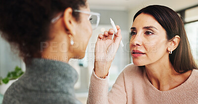 Buy stock photo Glasses, eye exam and checkup with women at optometrist for myopia, vision and help. Healthcare, ophthalmologist and optical frame with people in clinic for patient care, consulting and medical lens