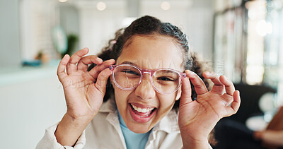 Buy stock photo Happy girl, portrait or glasses with vision for sight, optical or eyecare at optometry store. Female person, child or excited with spectacles for development or eye prescription at optometrist shop