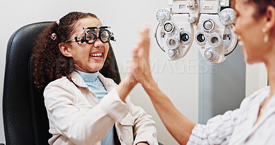 Buy stock photo Eye care, high five or happy optician with child in clinic with diagnostic tool for prescription lens. Ophthalmology, glasses or optometrist in vision assessment with kid, eyesight success or support