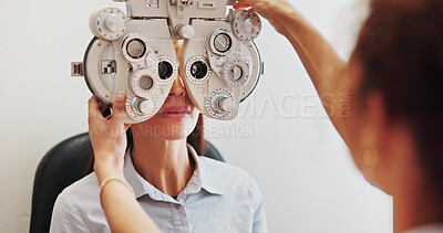 Buy stock photo Eye exam, optometry and optician with woman in clinic with phoropter for prescription lens. Ophthalmology, healthcare and optometrist with female patient for vision assessment with machine in store.