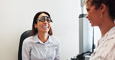 Buy stock photo Eye care, laughing or doctor with woman in hospital with diagnostic tool for prescription lens. Optometry, sight exam or optometrist in vision assessment with person, funny joke or medical equipment