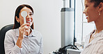 Eye test, check or cover with women in clinic with diagnostic tool for prescription lens or help. Service, depth perception or optometrist in vision assessment with person, optician or visual exam