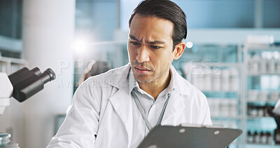 Buy stock photo Clipboard, confused and science with man in laboratory for healthcare, medical or pharmaceutical innovation. Doubt, microscope and study with scientist in clinical trial for breakthrough or research