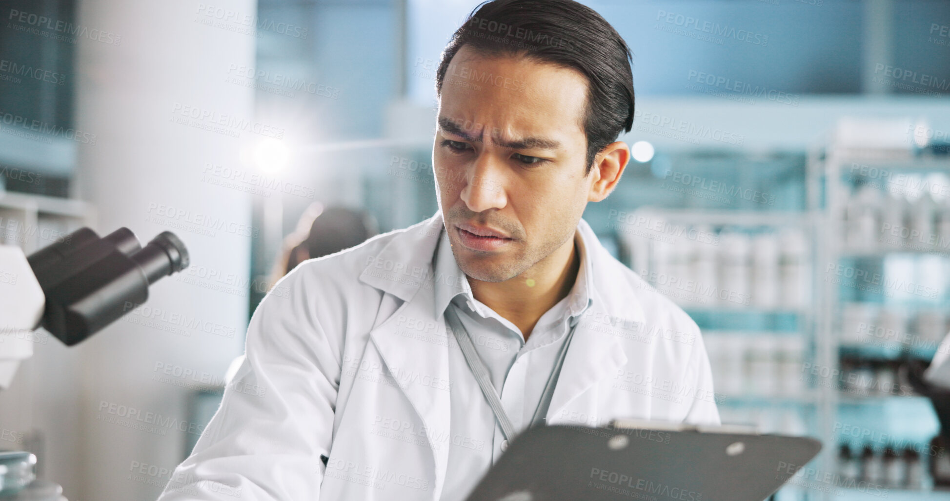 Buy stock photo Clipboard, confused and science with man in laboratory for healthcare, medical or pharmaceutical innovation. Doubt, microscope and study with scientist in clinical trial for breakthrough or research