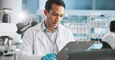 Buy stock photo Scientist, man and clipboard with checklist in laboratory for medical research, clinical trial and experiment results. Science, person and reading healthcare report for pharmaceutical study and notes
