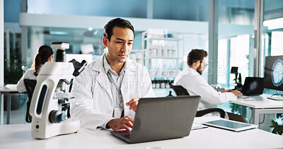 Buy stock photo Laptop, science and study with man in laboratory for healthcare, medical or pharmaceutical innovation. Computer microscope and online research with scientist in clinical trial for development
