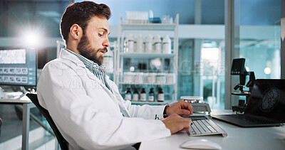 Buy stock photo Innovation, laptop and science with man in laboratory for healthcare, medical or pharmaceutical research at night. Computer, keyboard or typing with scientist in clinical trial in vaccine development