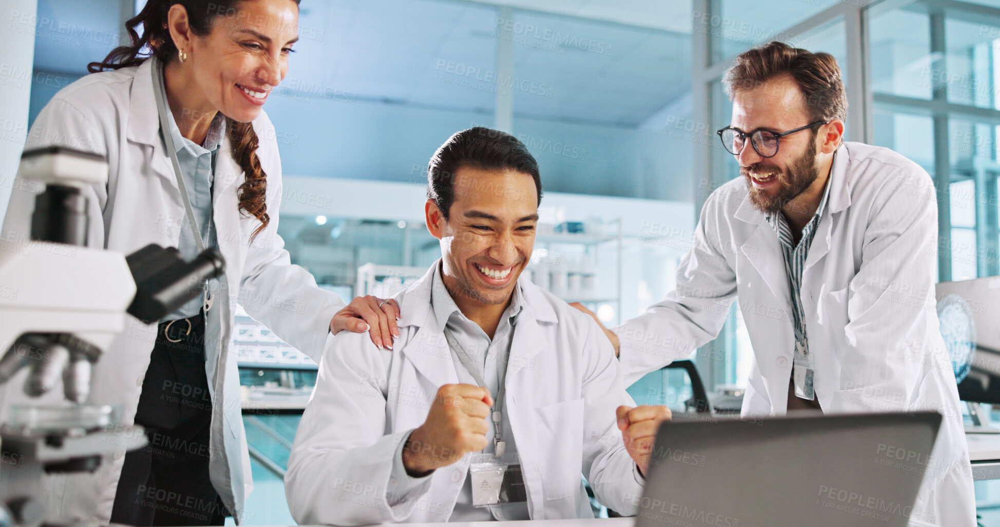 Buy stock photo Laptop, celebration and team of scientists in laboratory for medical research success for innovation. Cheering, computer and group of biologists with achievement for pharmaceutical science project.