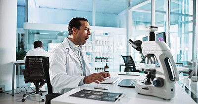 Buy stock photo Laptop, science and yawn with man in laboratory for healthcare, medical or pharmaceutical innovation. Computer, fatigue and microscope with tired scientist in clinical trial for development or study