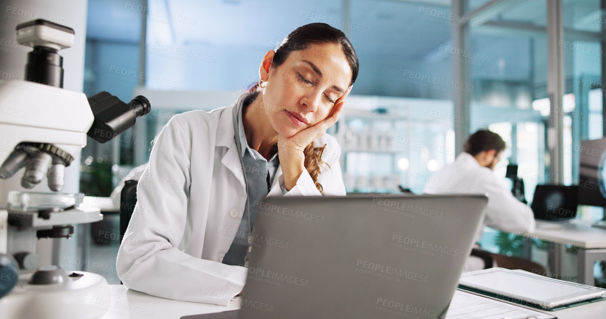 Buy stock photo Scientist, woman and tired with laptop for biology, overtime or medical analysis anxiety. Biotech, laboratory and microscope with sleep for RNA study burnout or chemical experiment project crisis