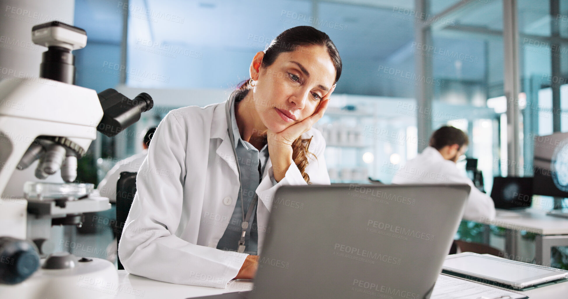 Buy stock photo Woman, scientist and tired with laptop for medical development, virus or research for bacteria dna. Person, fatigue and clinical study for vaccine with burnout, exhausted or pharmaceutical trial