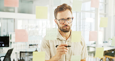 Buy stock photo Business man, sticky notes and planning by glass wall for campaign development and brand management. Marketing manager, employee and creative strategy for ROI monitor, project ideas and brainstorming
