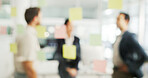Business people, blur or meeting with glass board for schedule planning, agenda or tasks at office. Group, employees or sticky notes with reminder or sticker for team brainstorming, strategy or ideas