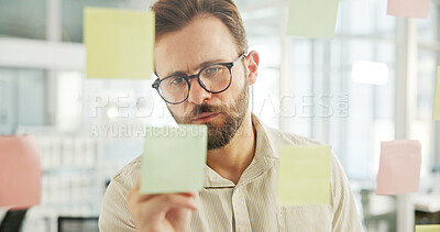 Buy stock photo Business man, glass wall and writing on sticky notes for campaign development, creative ideas and planning. Marketing manager, employee and brainstorming for advertising strategy or branding mind map