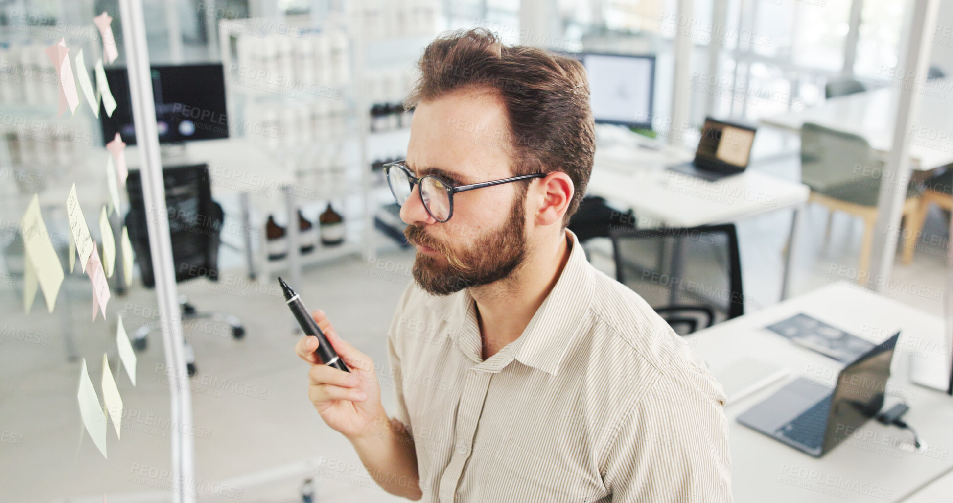 Buy stock photo Business, glass wall and man with creativity, decision and planning with ideas for proposal. Person, sticky notes o sales consultant with contemplation, problem solving and brainstorming for project