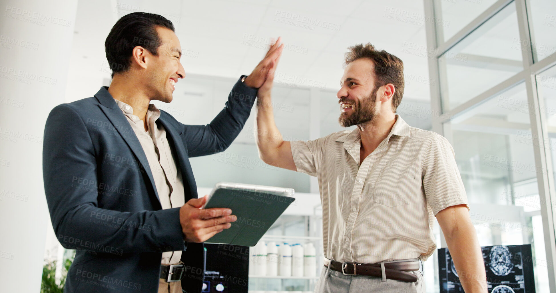 Buy stock photo Businessmen, tablet and success with high five for good news, health or CT results at office. People, medical business or employees with smile on technology for neurology study, MRI or brain scan