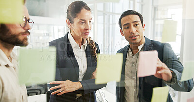 Buy stock photo Business, sticky notes and people with planning by glass wall for advertising campaign and project management. Marketing manager, teamwork and creative strategy for ROI monitor or brainstorming ideas