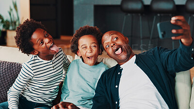 Buy stock photo Selfie, silly and dad with children on sofa for social media, profile picture and online post in home. Happy family, funny face and father with kids take photo for bonding, fun and goofy together