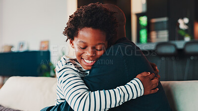 Buy stock photo Hugging, love and child with father in home for trust, safety or care together in living room. Happy, sweet and kid embracing dad for protection, connection or bonding on weekend with family in house