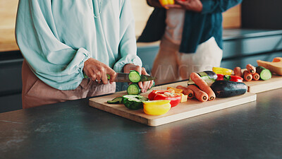 Buy stock photo Hands, couple and cooking in kitchen with vegetables, knife and support with meal prep in home. People, organic ingredients and cutting board for food, diet and together for nutrition at apartment